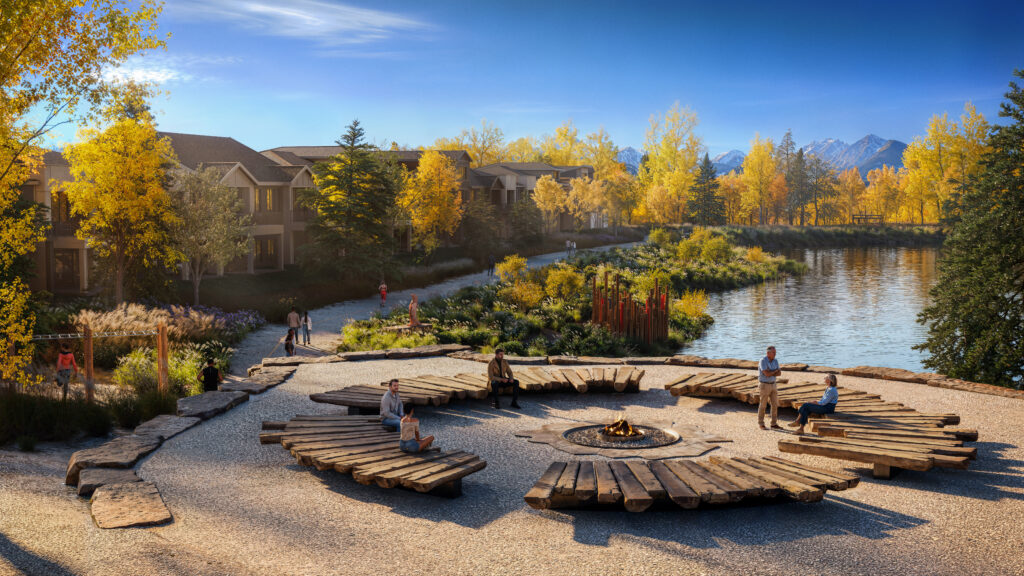 Rendering of an outdoor gathering space with wood benches surrounding a fire feature and overlooking a pond with fall foliage in the background