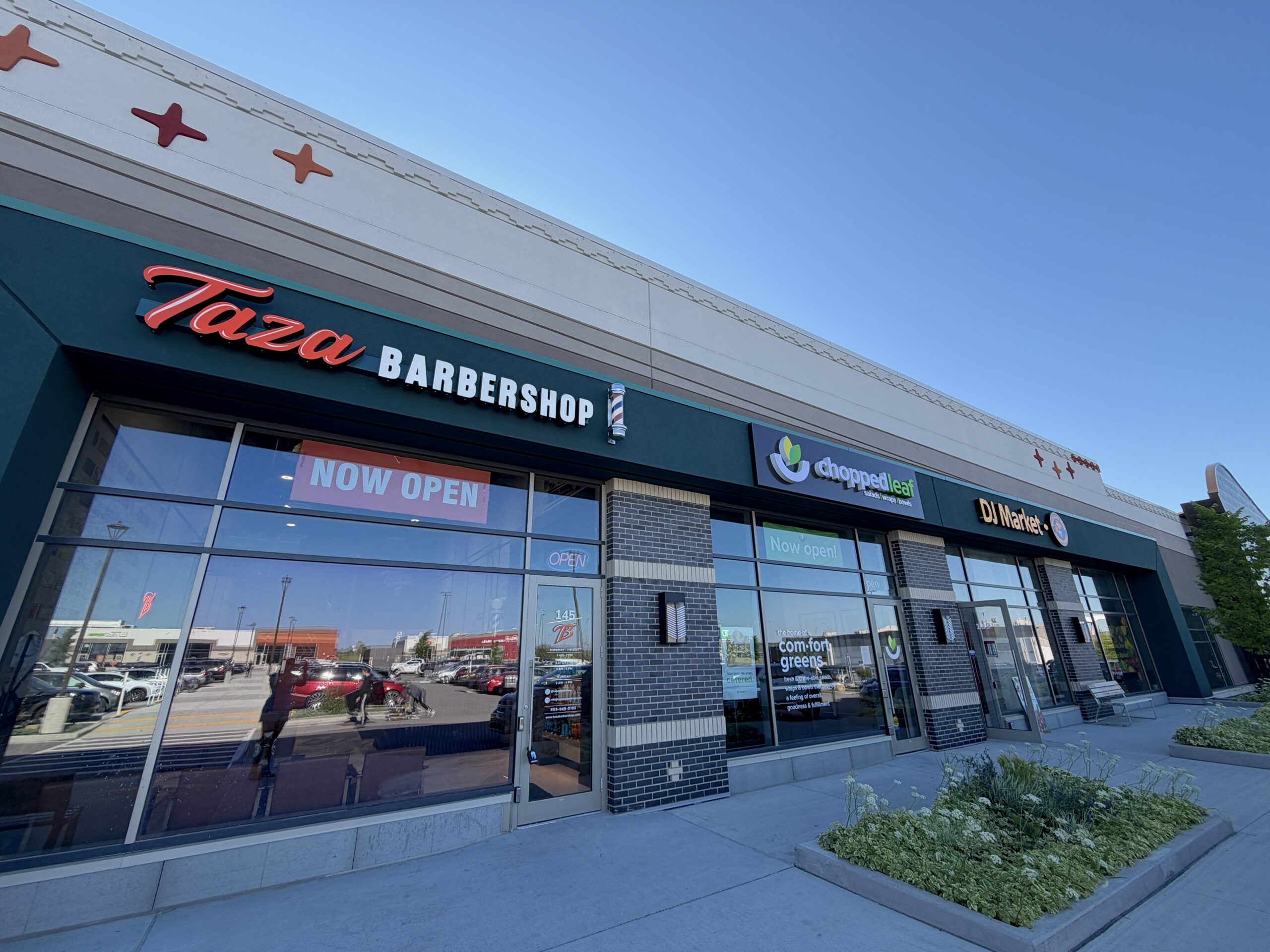 Storefront of Taza Barbershop, Chopped Leaf and DJ Market in Buffalo Run