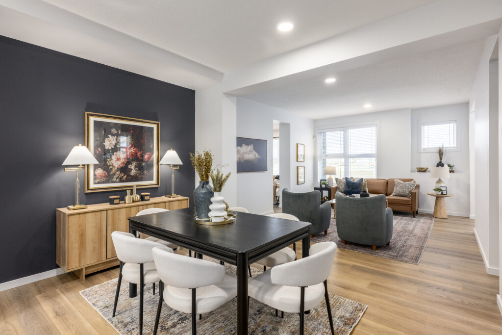 Aurora's modern, open-plan layout features a dining area connected to a living room, with bright natural light and wooden floors.
