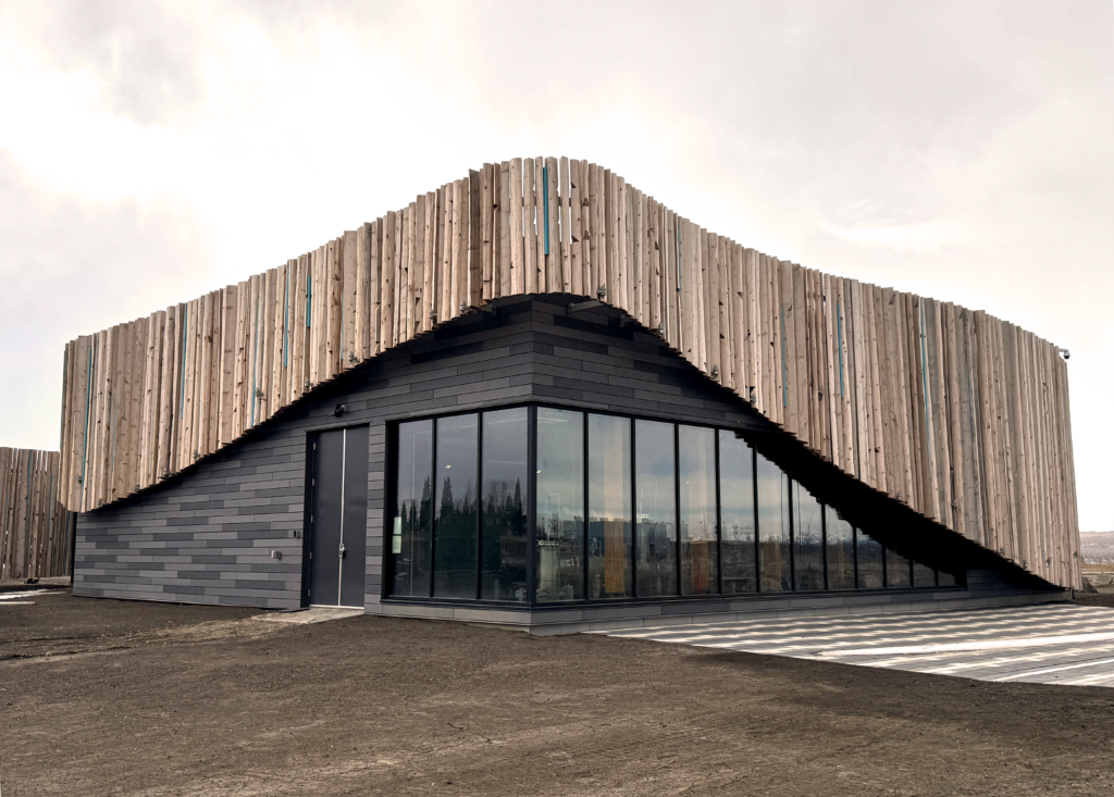 Water reservoir and pumphouse in Taza Park with organic wood finishes and large viewing windows.