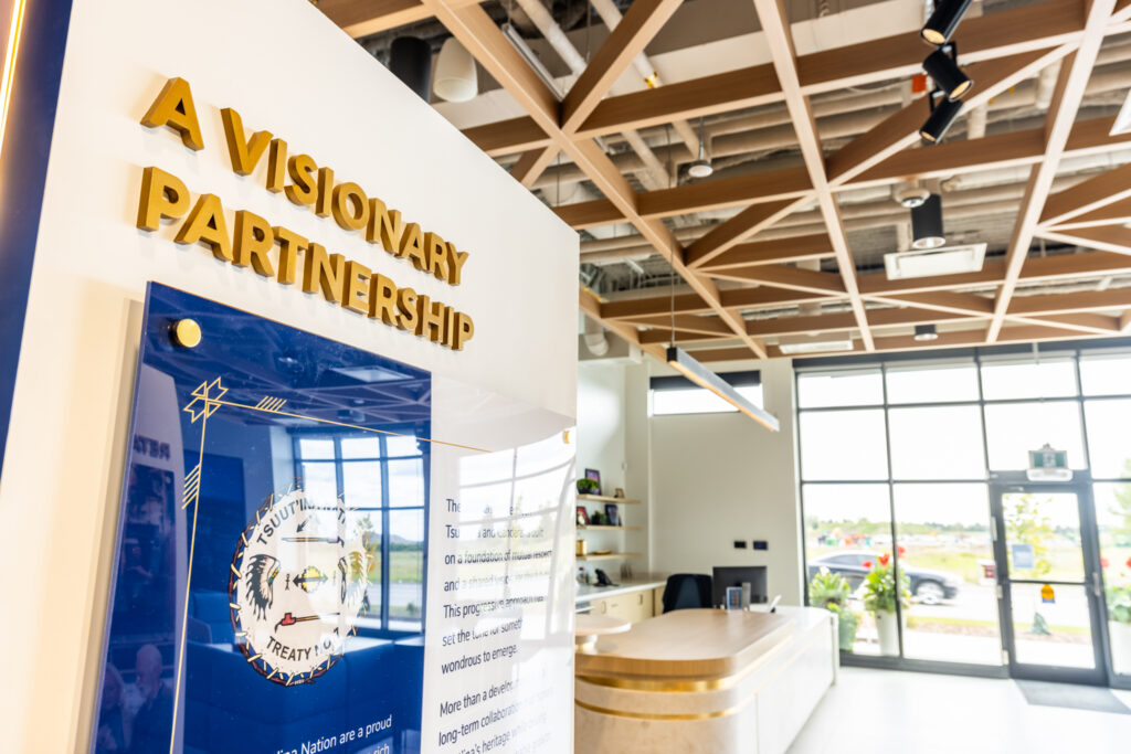 Sign reading "A Visionary Partnership" inside the Sales & Marketing Centre.